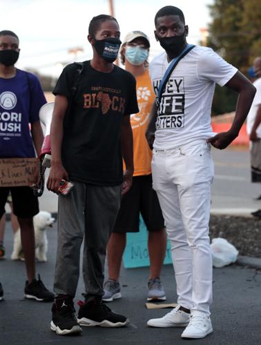 Protesters march in Florissant