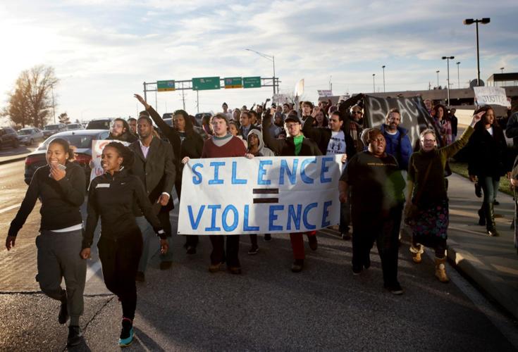 Protesters march around West County Center and on Manchester Road
