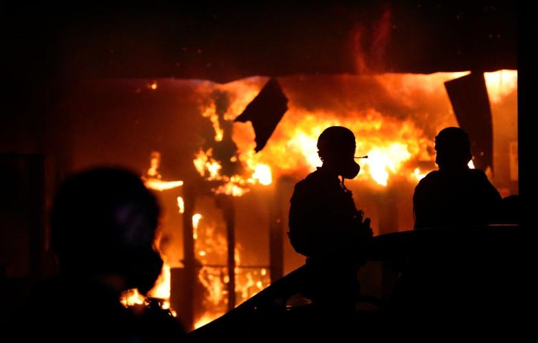 Vandals set fire to downtown 7-Eleven following protest at police station