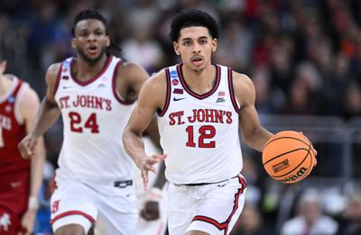 Mar 22, 2025; Providence, RI, USA; St. John's Red Storm guard RJ Luis Jr. (12) dribbles during the second half of a second round men’s NCAA Tournament game against the Arkansas Razorbacks at Amica Mutual Pavilion. Mandatory Credit: Brian Fluharty-Imagn I