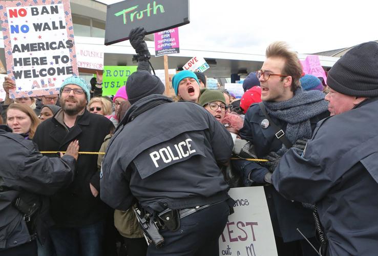 Protesters converge on Lambert over Trump policies