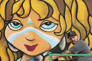 Paint St. Louis puts new art on an old downtown St. Louis wall