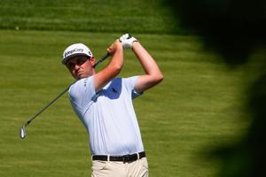 J.T. Poston prepares to hit the ball on the 11th fairway during the final round of the Memorial Tournament at Muirfield Village