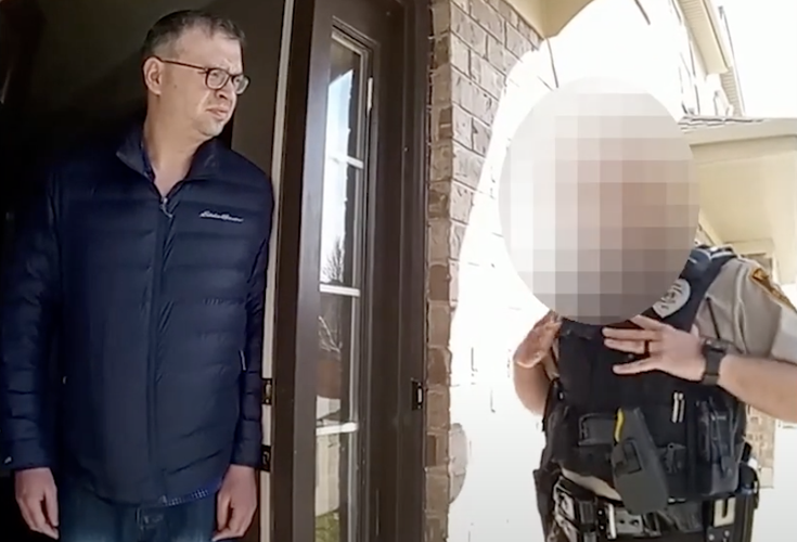 Dr. Lanis talks to officers on his front porch
