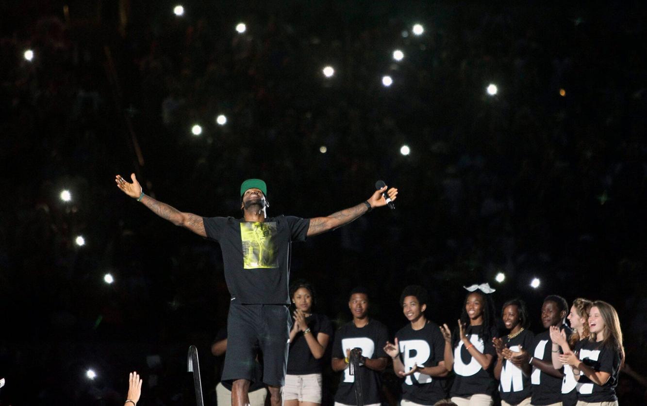 LeBron James acknowledges the crowd's reaction as he takes the stage ...