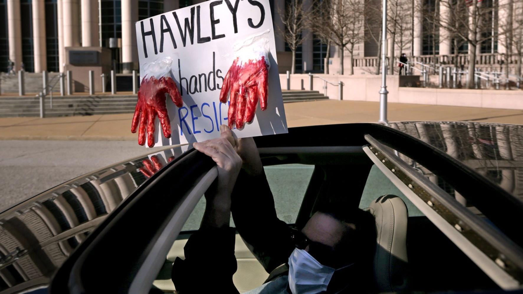 Protesters say Hawley has 'blood on his hands' and should step down