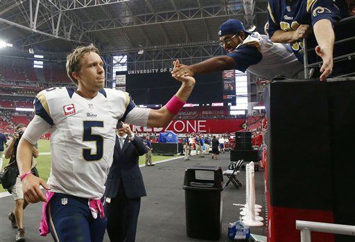 Quarterback Nick Foles of the St. Louis Rams walks off the field