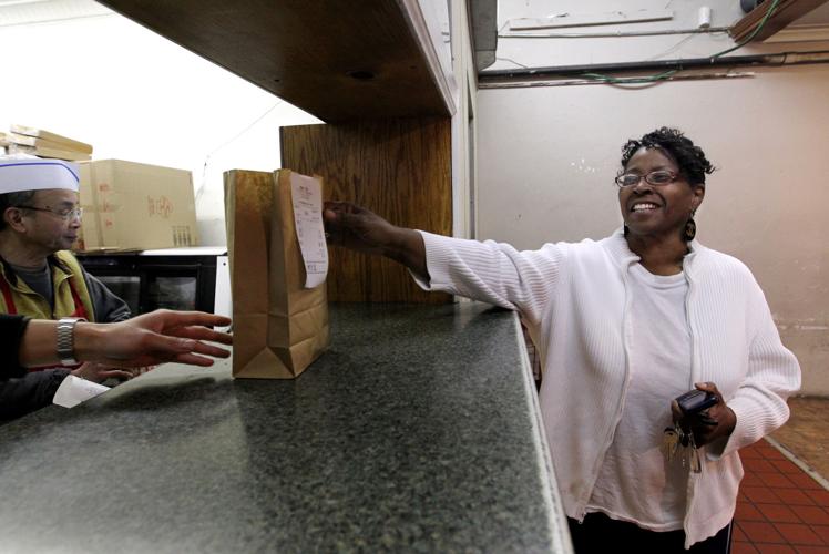 Customer picks up their order at Mandarin Inn