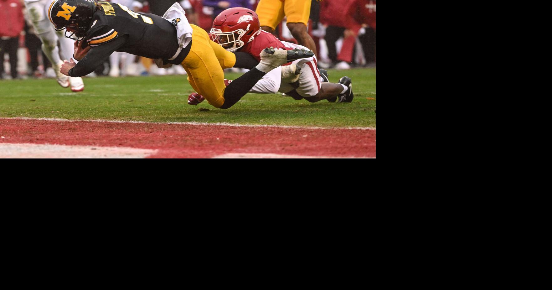 The Tigers overcame ball security errors and an invisible passing game to beat the Razorbacks in the regular season finale.