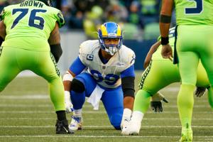Oct 7, 2021; Seattle, Washington, USA; Los Angeles Rams defensive end Aaron Donald (99) waits for a snap against the Seattle Seahawks during the second quarter at Lumen Field. Mandatory Credit: Joe Nicholson-USA TODAY Sports