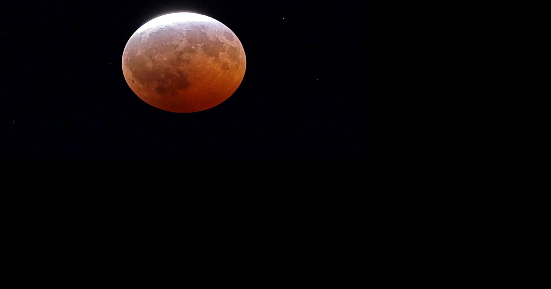 Photos: Partial lunar eclipse over St. Louis delights at Science Center