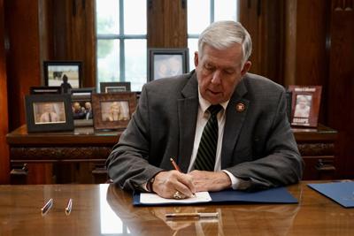 Parson signs transgender bills into law
