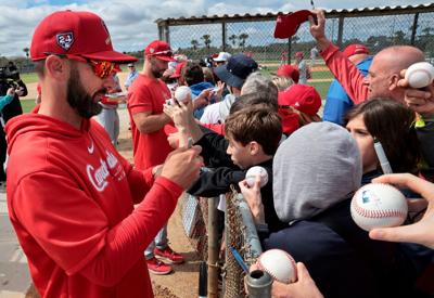 Full squad reports, first team meeting held at Cardinals spring training