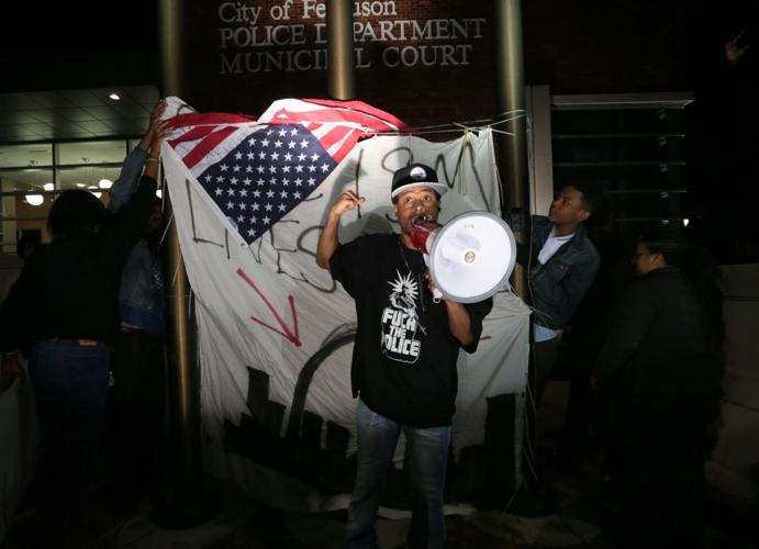 More than 150 demonstrators protest in front of Ferguson Police Station