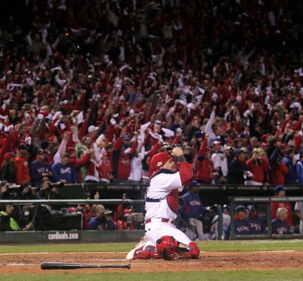 St. Louis Cardinals Lance Berkman embraces Albert Pujols after the  Cardinals won the 2011 World Series in St. Louis on October 28, 2011. The  Cardinals defeated the Texas Rangers 6-2 winning game