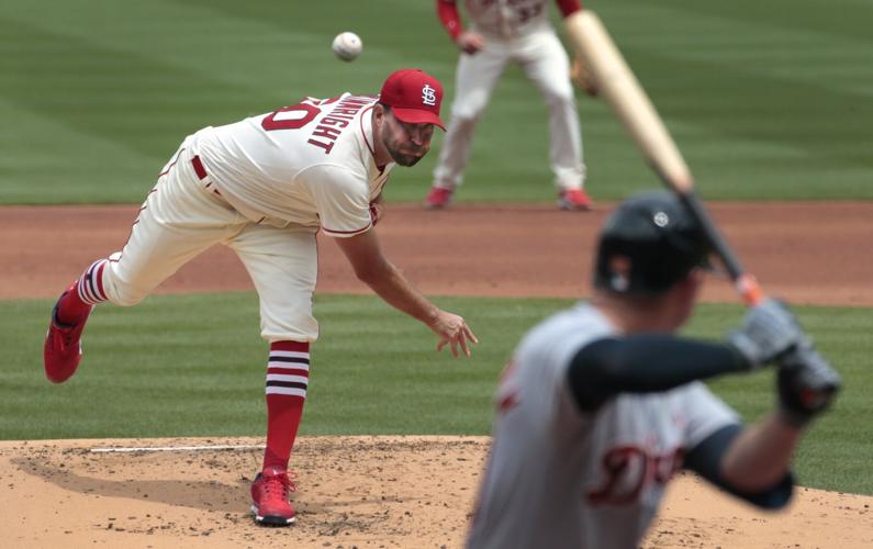 St. Louis Cardinals starting pitcher Adam Wainwright wipes his