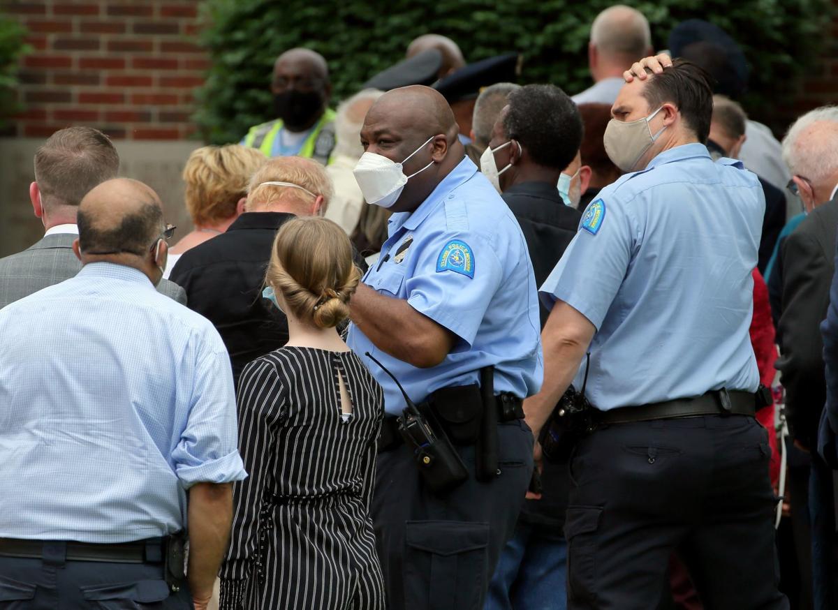 St. Louis police officer struck by vehicle at funeral of expolice