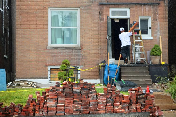 Tornado victims ponder reuse of fallen bricks