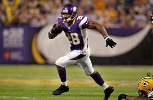Dec 30, 2012; Minneapolis, MN, USA; Minnesota Vikings running back Adrian Peterson (28) rushes against the Green Bay Packers in the second quarter at the Metrodome. Mandatory Credit: Bruce Kluckhohn-USA TODAY Sports