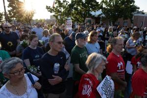 Community holds vigil for Overland couple slain after deportation