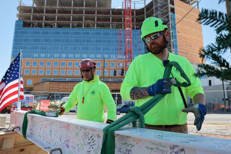 SMM Health holds a ‘topping off’ ceremony with signed beam on new pediatric 14-story hospital