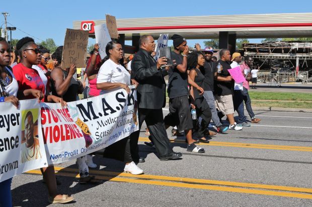 Ministers try peaceful protest through Ferguson