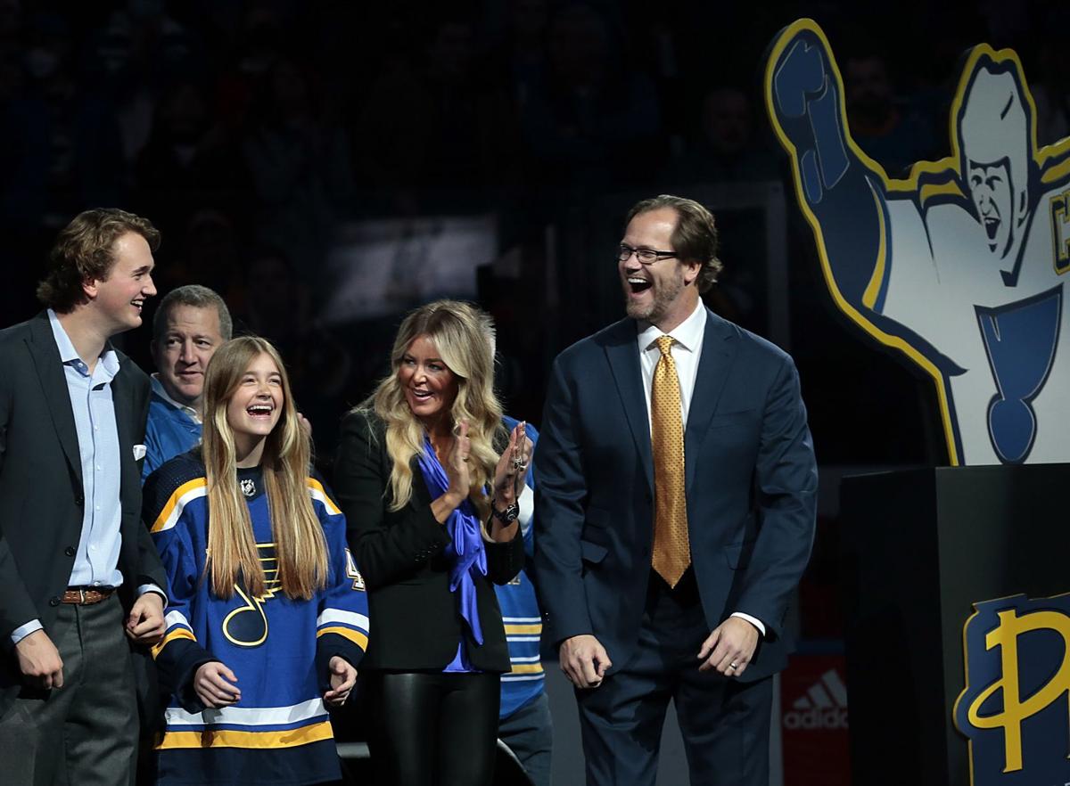 Toast of the town: Pronger hoists a beer while his banner is raised into  Blues lore