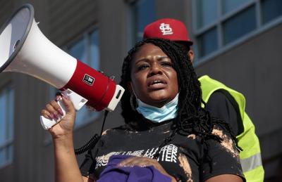 Protesters march through the Delmar Loop
