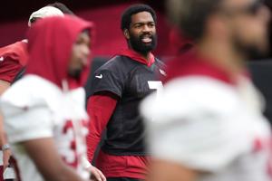Arizona Cardinals quarterback Jacoby Brissett (7) practices during a walkthrough in training camp at State Farm Stadium in