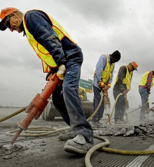MoDOT workers repair bridge concrete