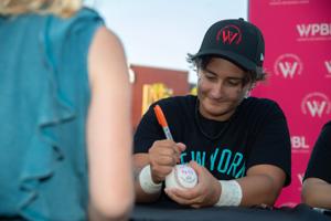 Women’s Pro Baseball League (WPBL) player Alyssa Zettlemoyer signs autographs after a demonstration practice at the Banner Island Ballpark in downtown Stockton on Jul. 2, 2026. The fledgling WPBL made a stop in Stockton as a part of its “Countdown To