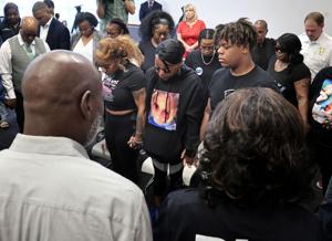 Ferguson police arrest three in bystander mother’s shooting death