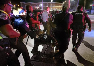 Protesters reunite outside the Ferguson police department on 10th anniversary