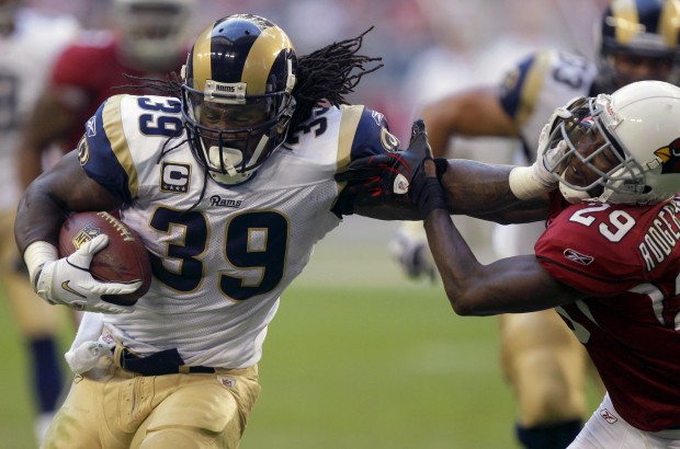 St. Louis Rams quarterback Sam Bradford enters the game for the first time,  clapping as he tries to get his team fired up against the Minnesota Vikings  in the second quarter of