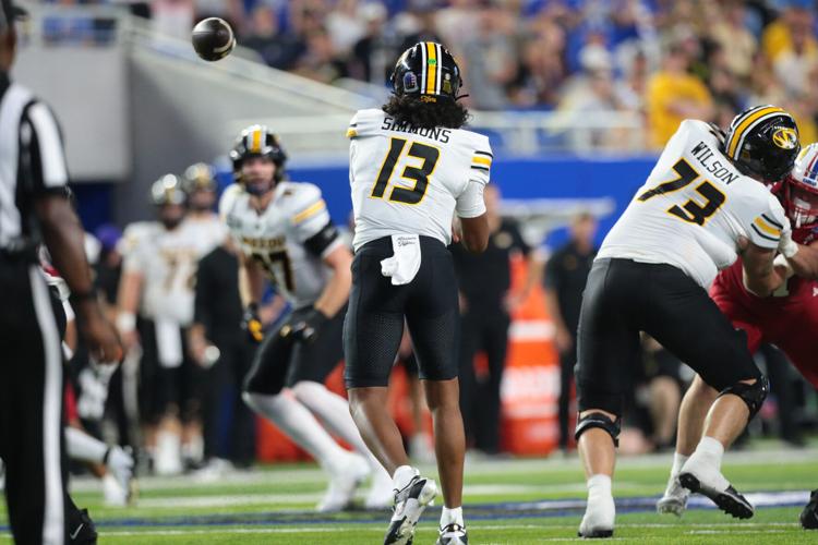 Missouri Tigers quarterback Austin Simmons (13) throws the ball against Kansas Jayhawks during the game inside David Booth