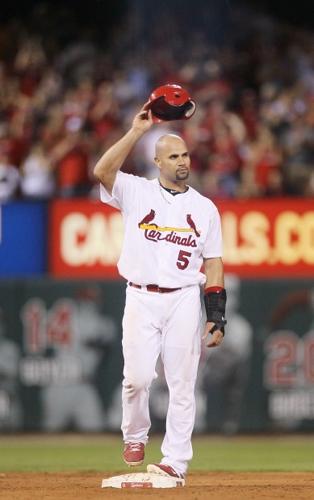 Pujols homers twice, lifts career total to 692 in Cards' win