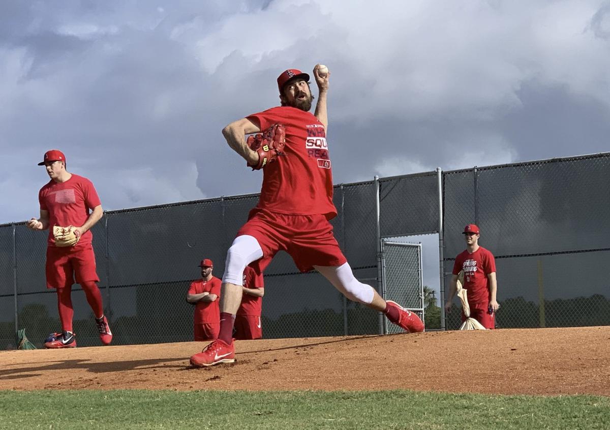 Adam Wainwright & Yadier Molina St. Louis Cardinals Unsigned Bump Gloves  Photograph