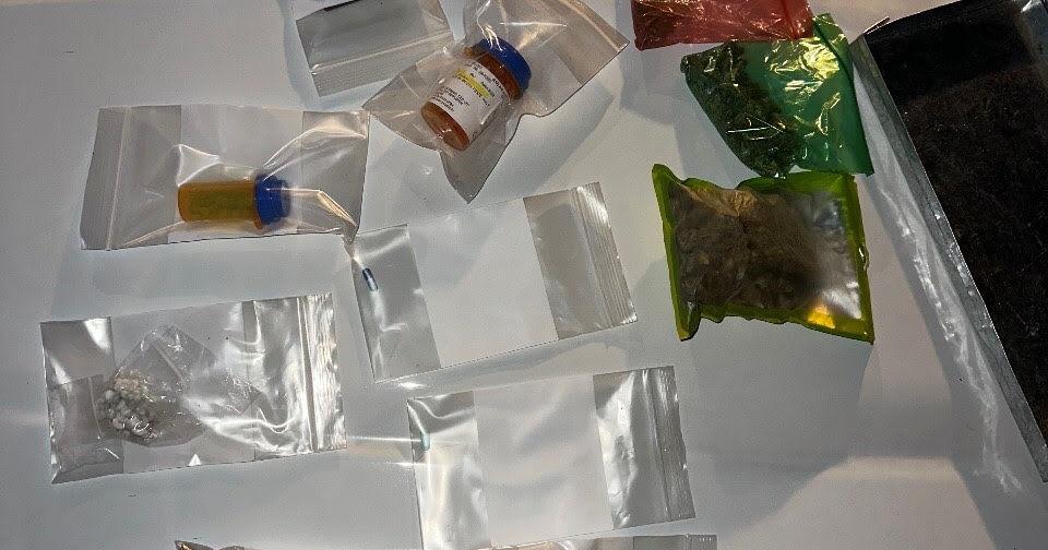 Search warrant leads to two individuals arrested for dealing drugs