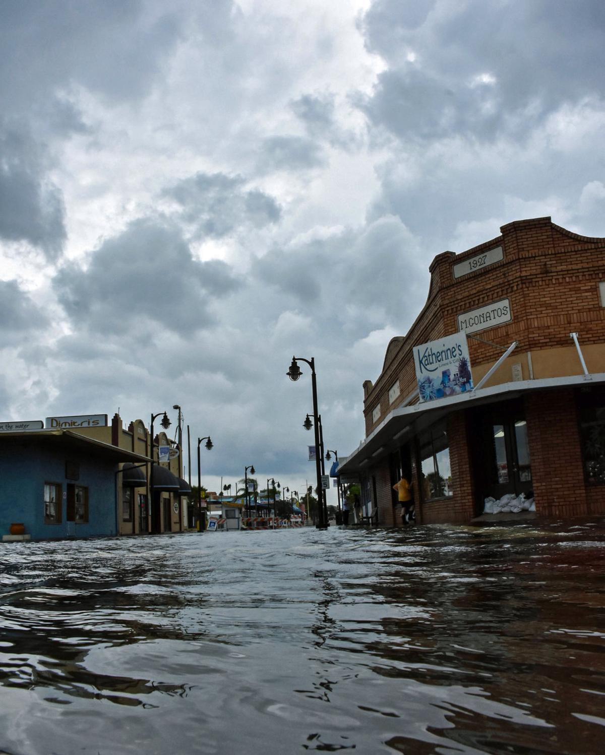 Tidal flooding again closes Sponge Docks main street ...