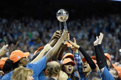 Los Angeles Sparks celebrate WNBA championship with their trophy