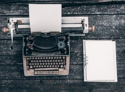 letter to editor stock art typewriter and notebook