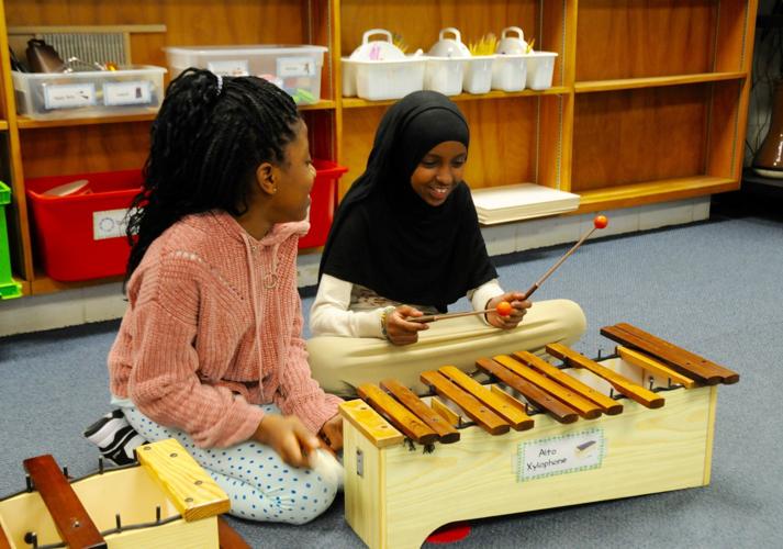 Students playing xylophone