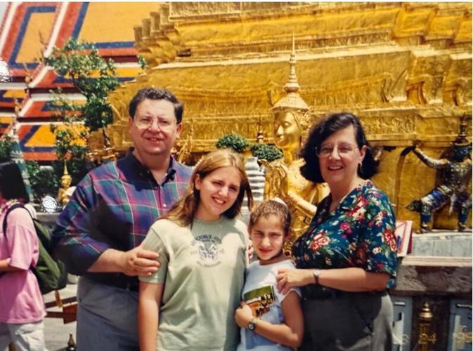 The Pennas with their daughters in Thailand in 2009.