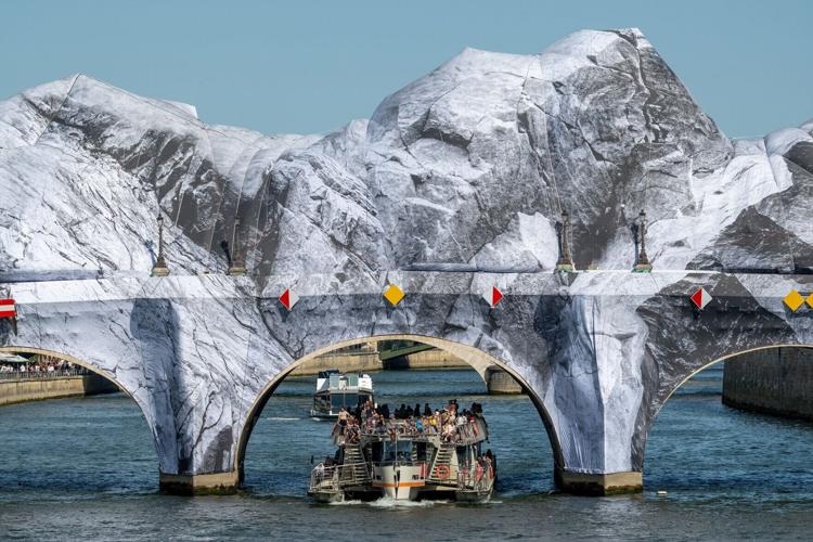 The Caverne du Pont-Neuf, the monumental installation by French artist and photographer JR, with the canvas consolidated with ropes after storm damage, in Paris, France on June 14, 2026.