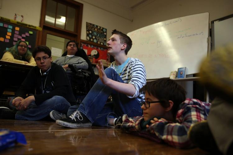 Lane Tech High School book club's Levi Todd, 16, talks during club meeting after class in Chicago on March 20, 2013.