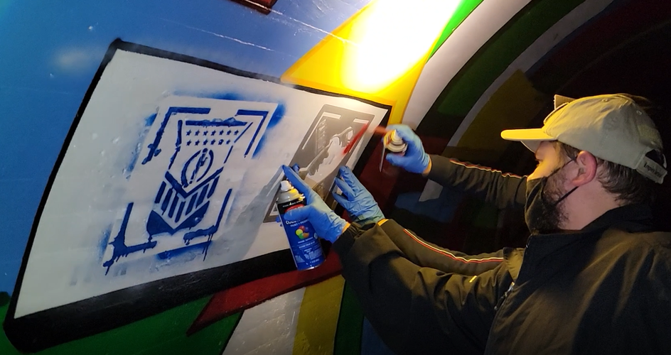 Patriot Front members spray paint over Arthur Ashe's accomplishments on Oct. 18, 2021