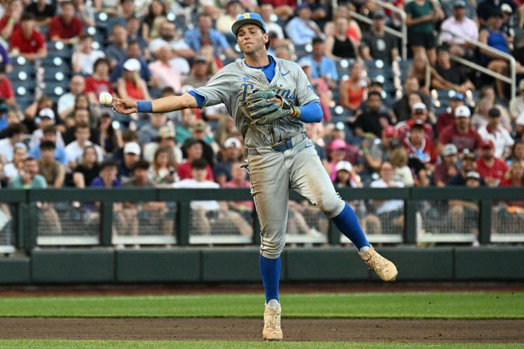 UCLA shortstop Roch Cholowsky (1) throws to first base against Arkansas during the 2025 College World Series at Charles Schwab Field.