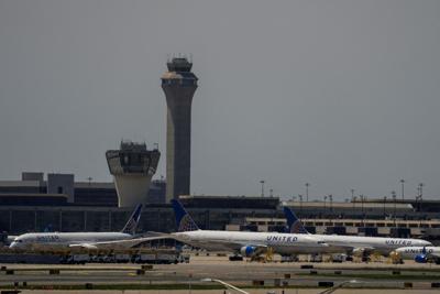 FILE PHOTO: The control tower is pictured as planes are seen on the tarmac at Newark International Airport in Newark, New Jersey