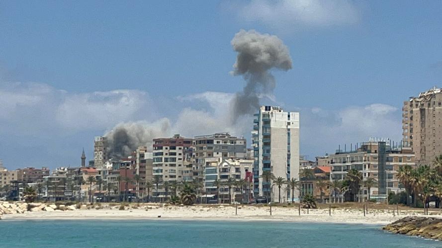 Smoke billows following an Israeli strike in Tyre