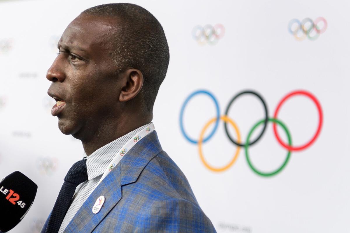 In this photo from July 11, 2017, US Olympic track and field legends Michael Johnson answers to reporters after the Los Angeles 2014 bid presentations before the International Olympic Committee members in Lausanne.